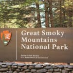 A large sign welcomes visitors to the entrance of Great Smoky Mountains National Park